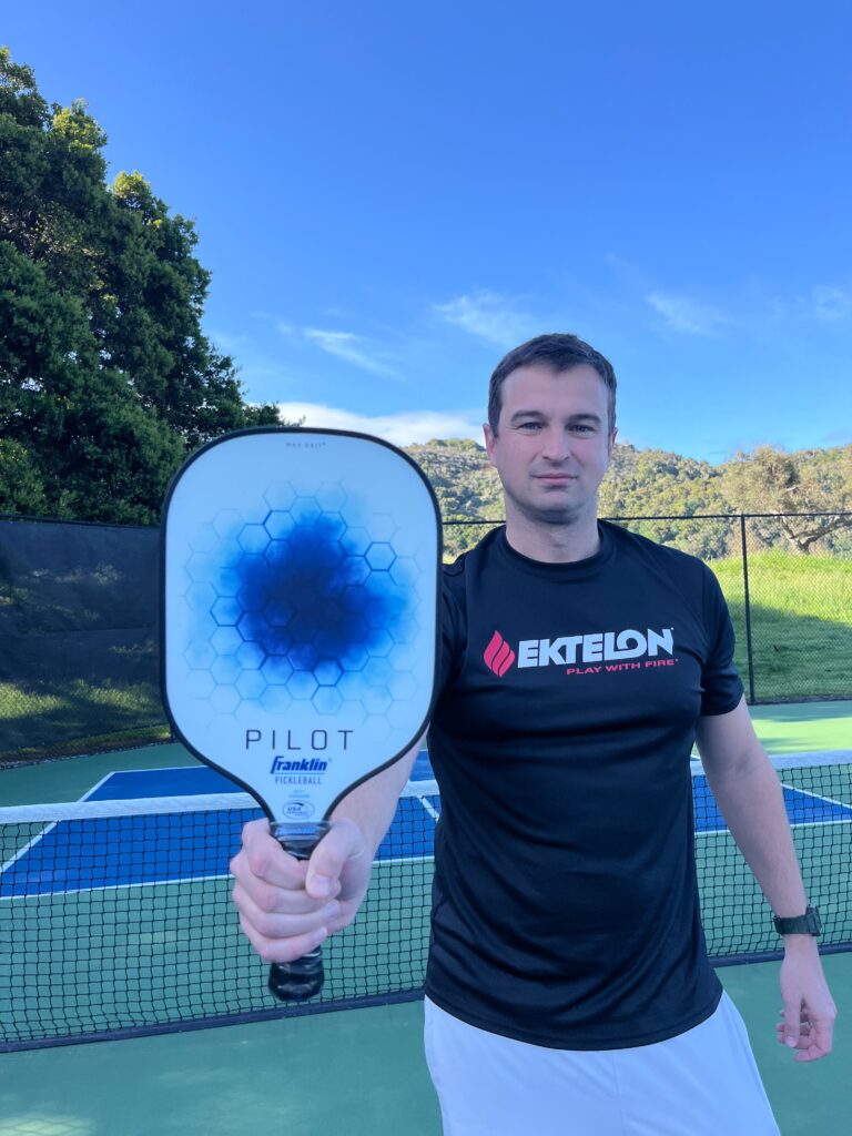 Picture of man with Franklin pickleball paddle.