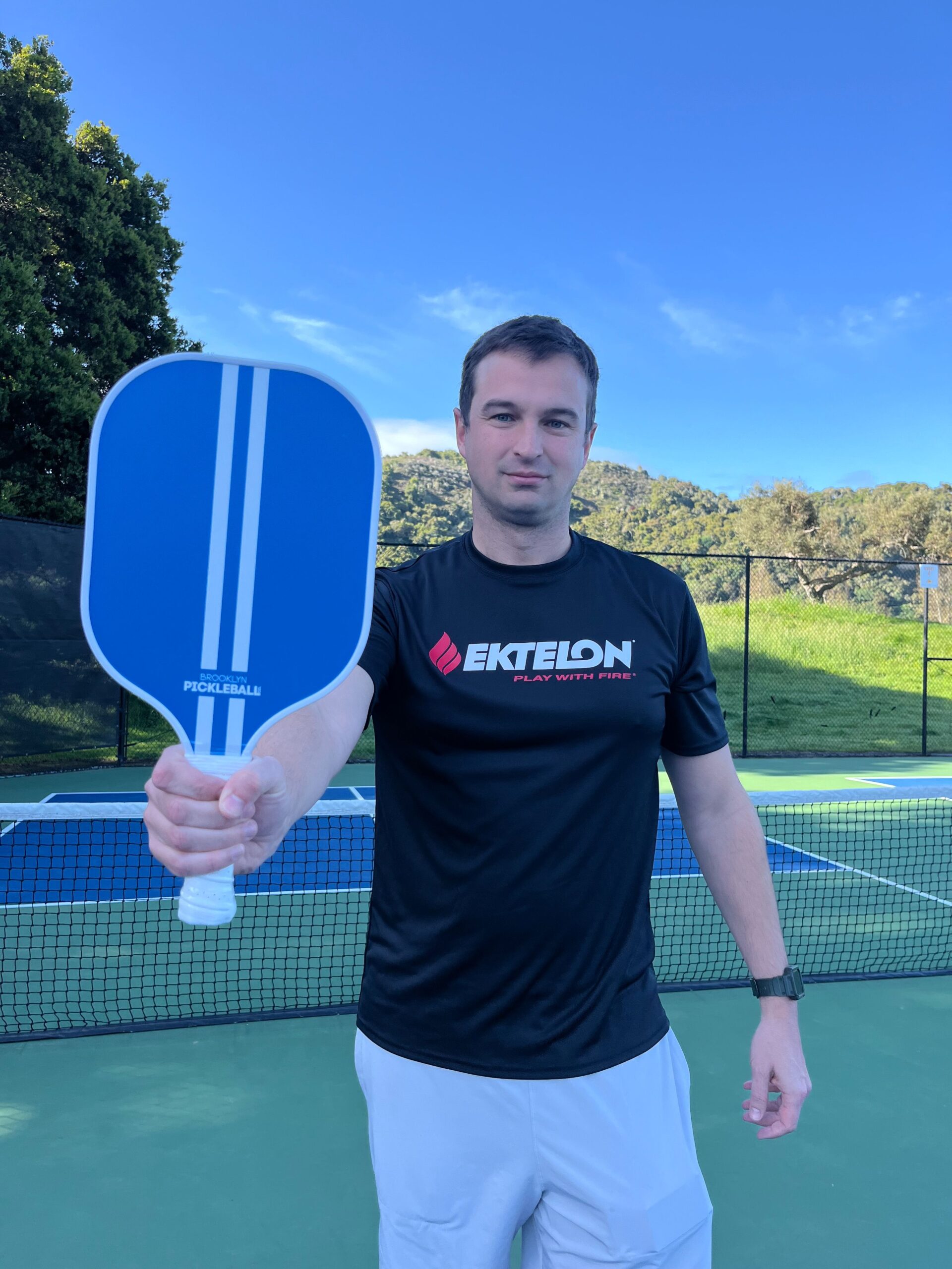 picture of man practicing pickleball alone