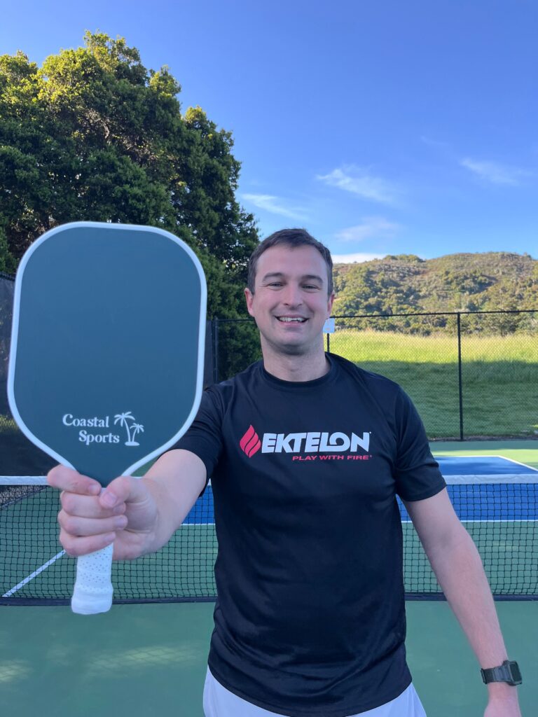 Picture of author with the coastal sports budget pickleball paddle