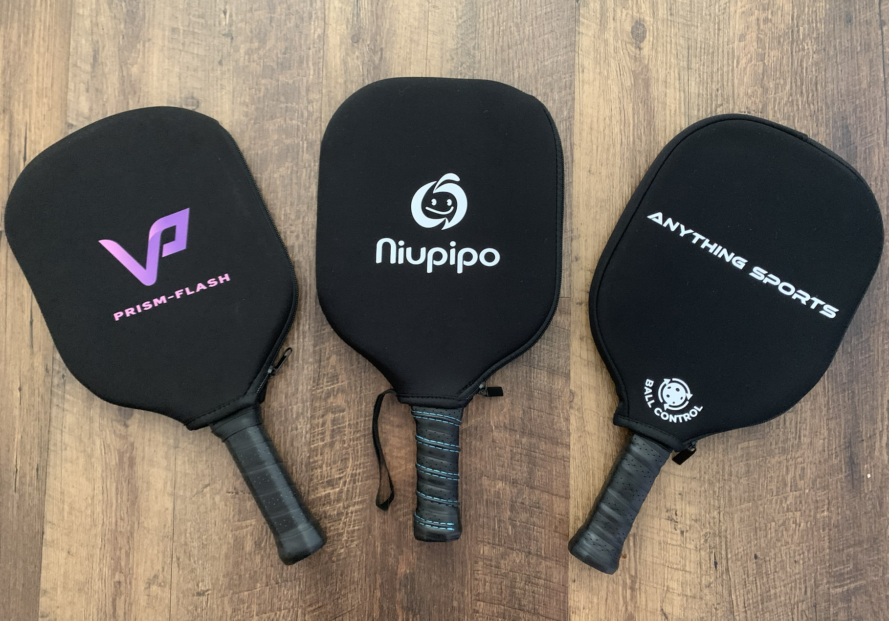 Picture of Niupipo pickleball paddle next to 2 alternatives