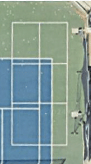 aerial view of pickleball court by a tennis court