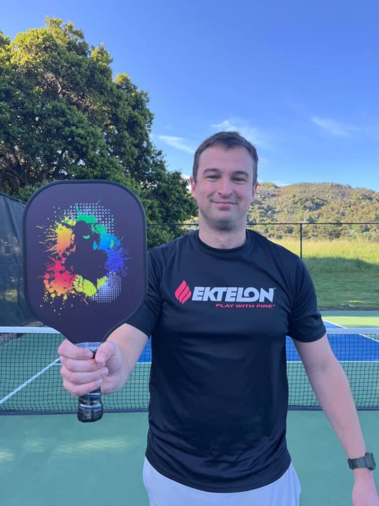 Picture of me holding a fiberglass pickleball paddle.