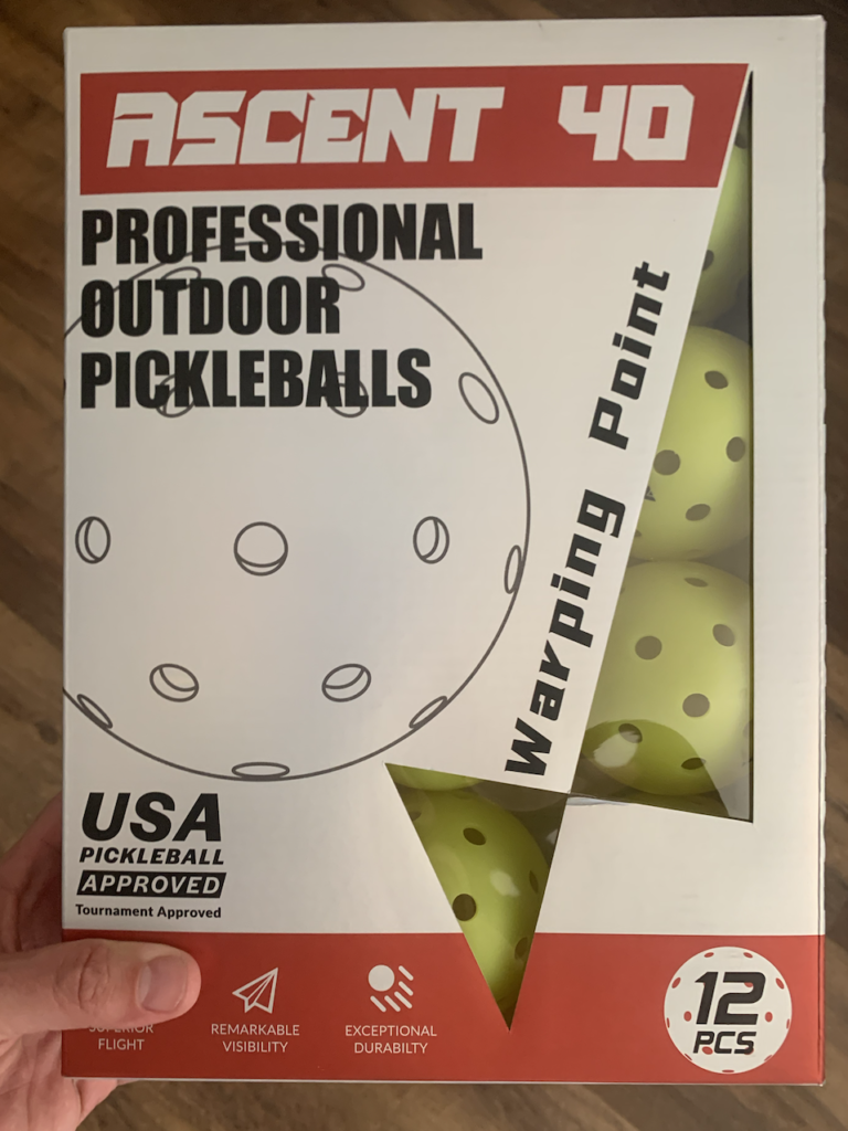 Box carrying Warping Point outdoor pickleball balls.