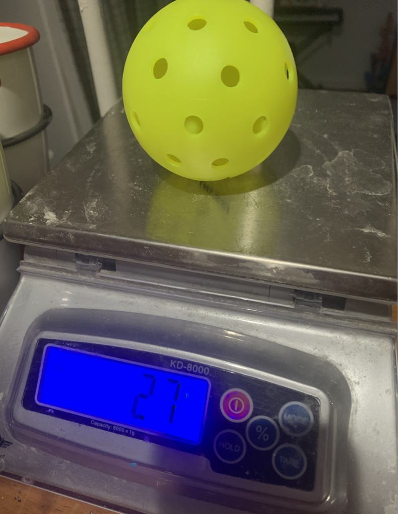 The Warping Point outdoor pickleball balls weigh 27 grams.