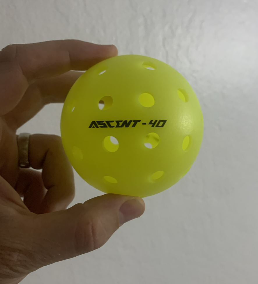 Close up picture of the Warping Point Ascend pickleball ball.