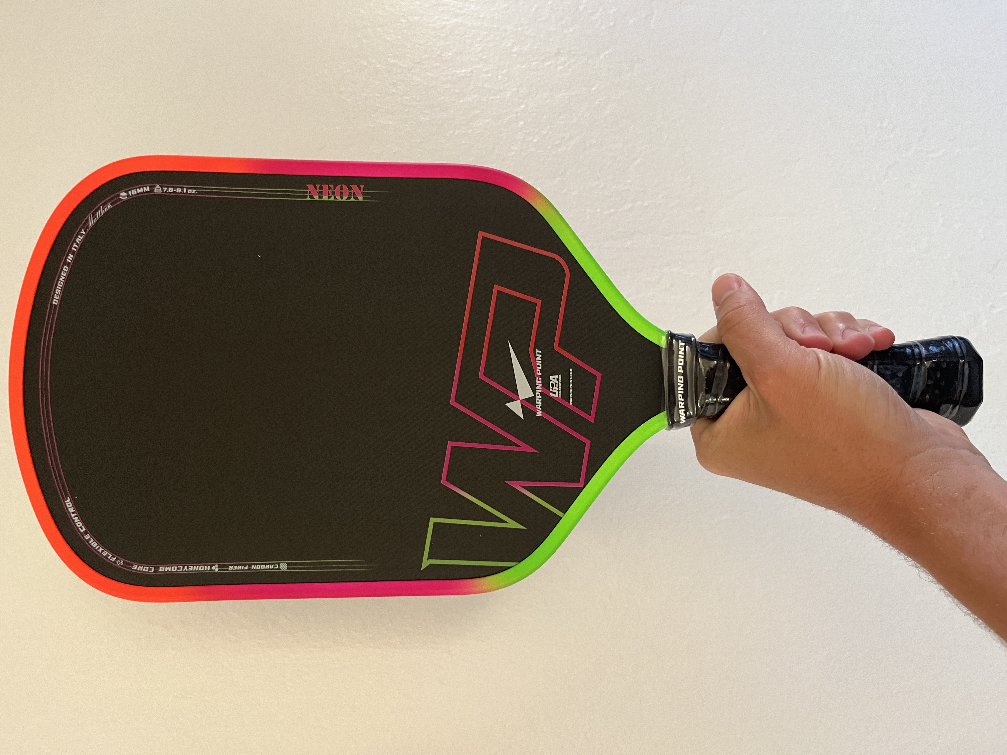 Picture of the red and green Warping Point, paddle that is the best under $100.