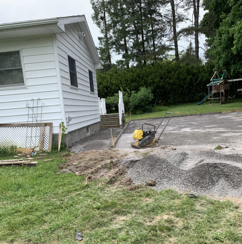 Picture setting up cheap backyard pickleball court and leveling out the court