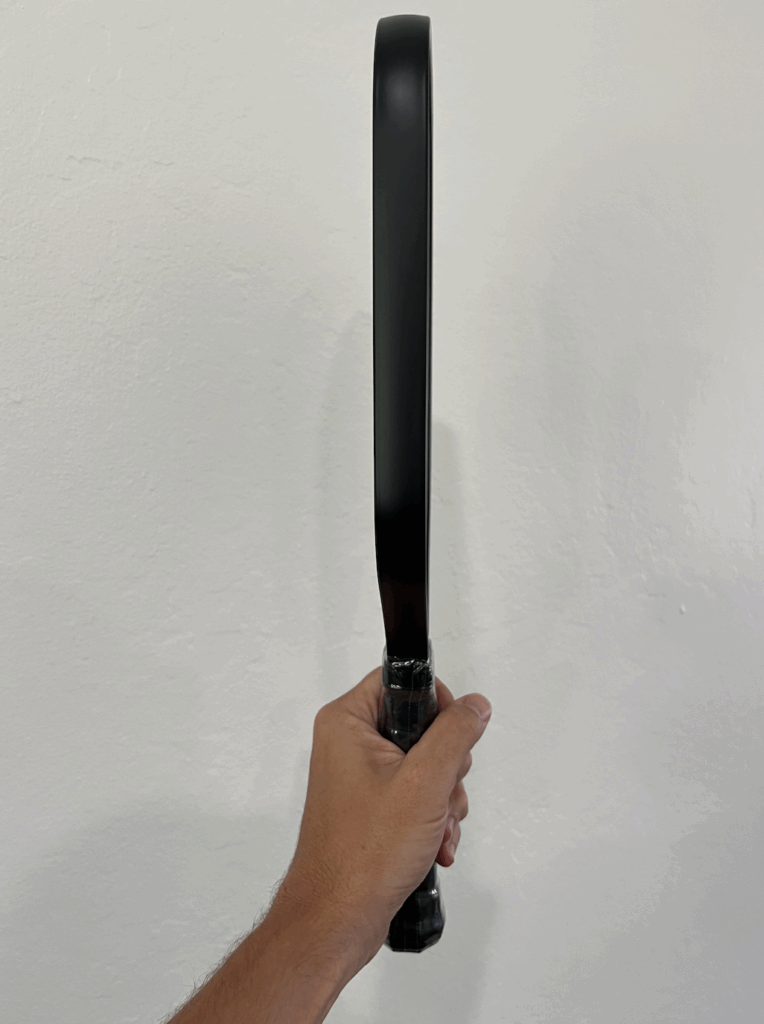 Side picture of the Aura Pro pickleball paddle.