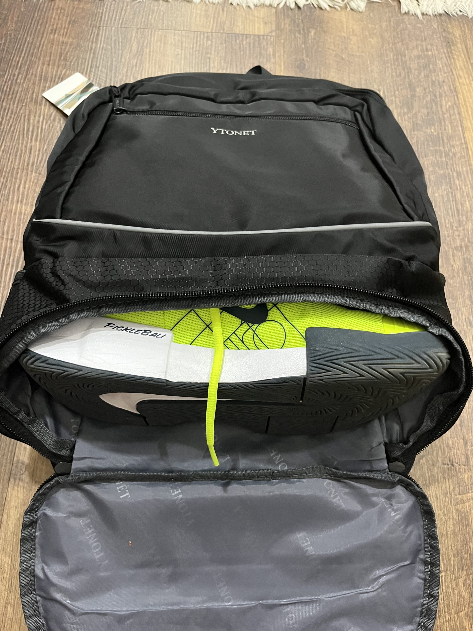 Picture of the Women's Ytonet pickleball bag showing the shoes in the bag.