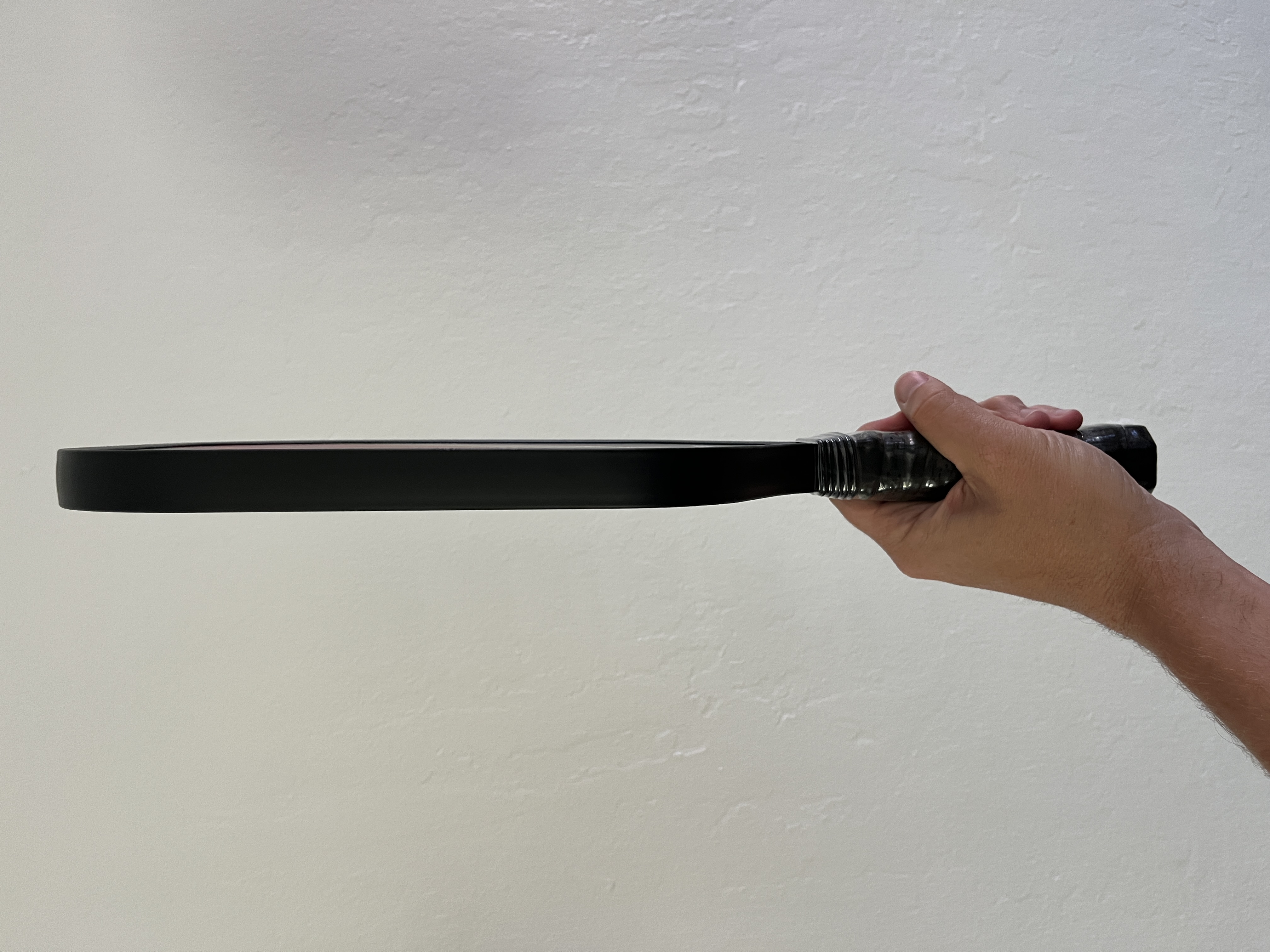 Picture of the side of the cheapest carbon fiber pickleball paddle.