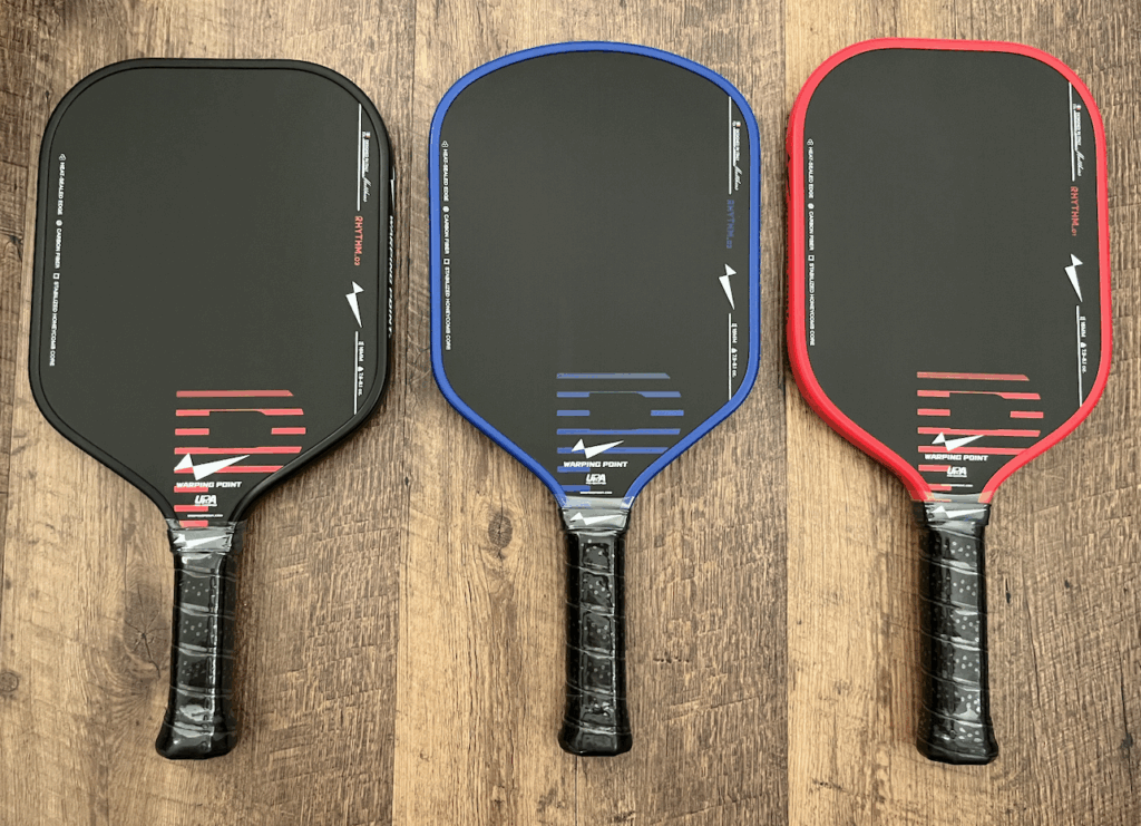 Picture of 3 Rhythym pickleball paddles by different size.