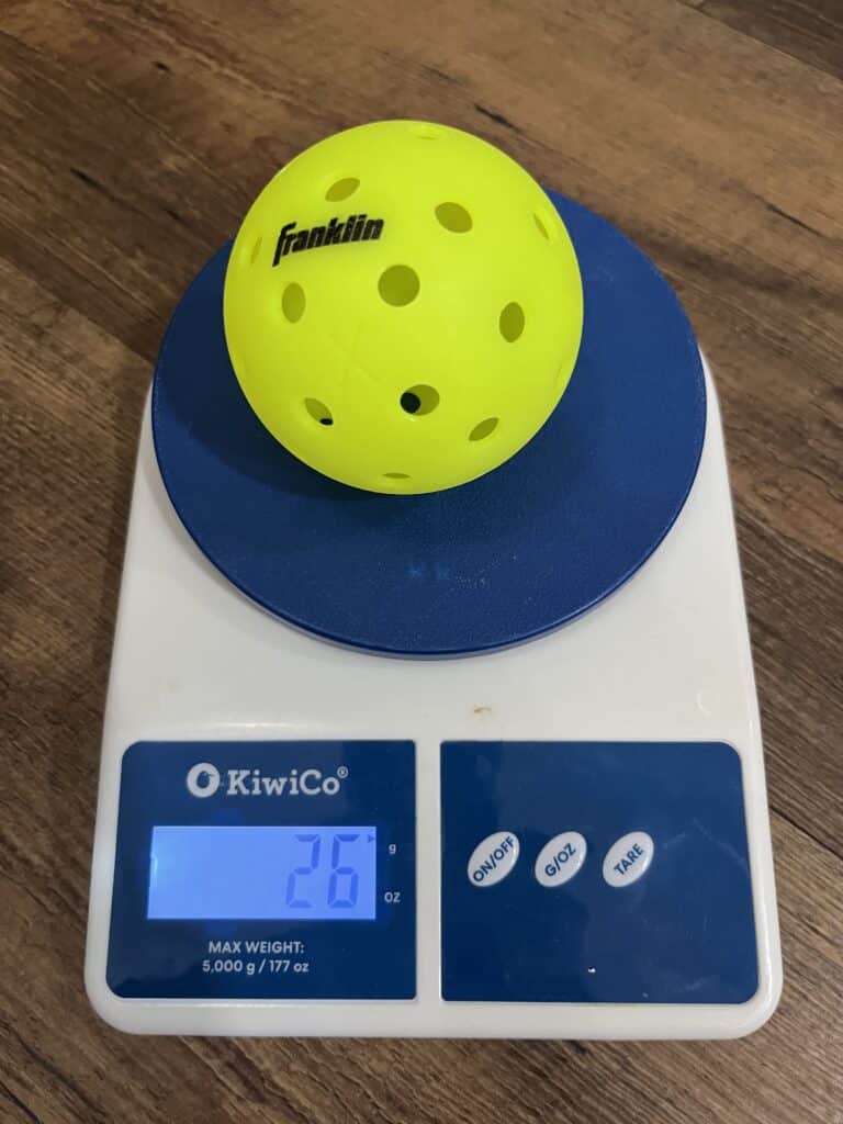 Picture of the best Franklin X-40 outdoor pickleball ball on the scale.