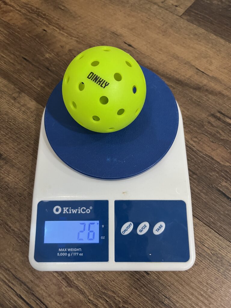 Picture of Dinkly outdoor pickleball ball on the scale.