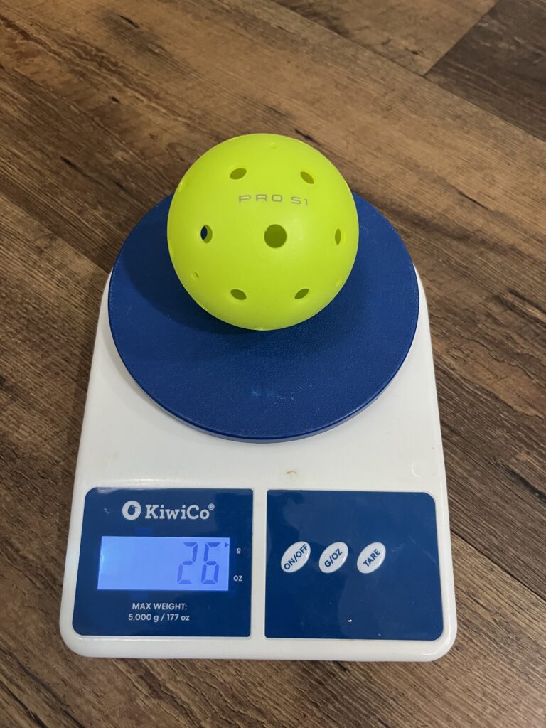 Picture of Selkirk Pro S1 outdoor pickleball ball on the scale.