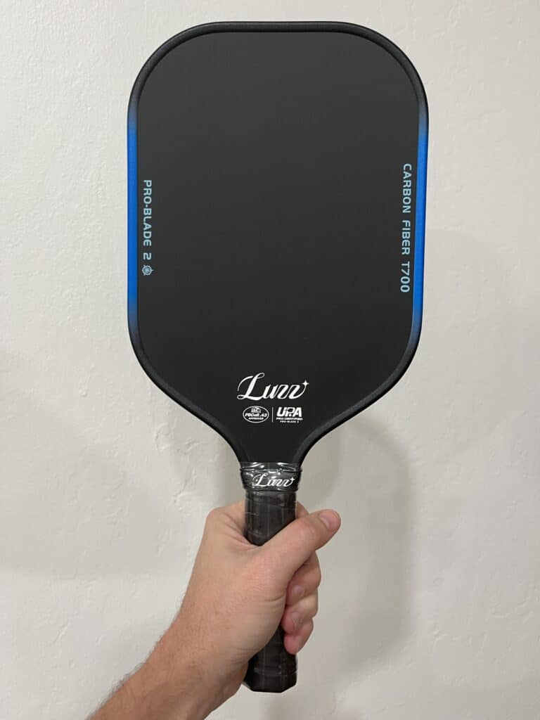 Picture of me holding the new Chris Haworth pickleball paddle which is the Luzz Blade 2 released in 2026.