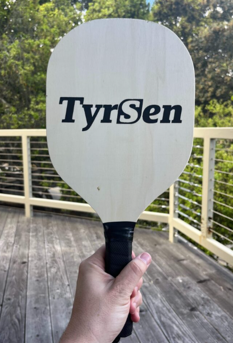 Picture of wooden pickleball paddle.
