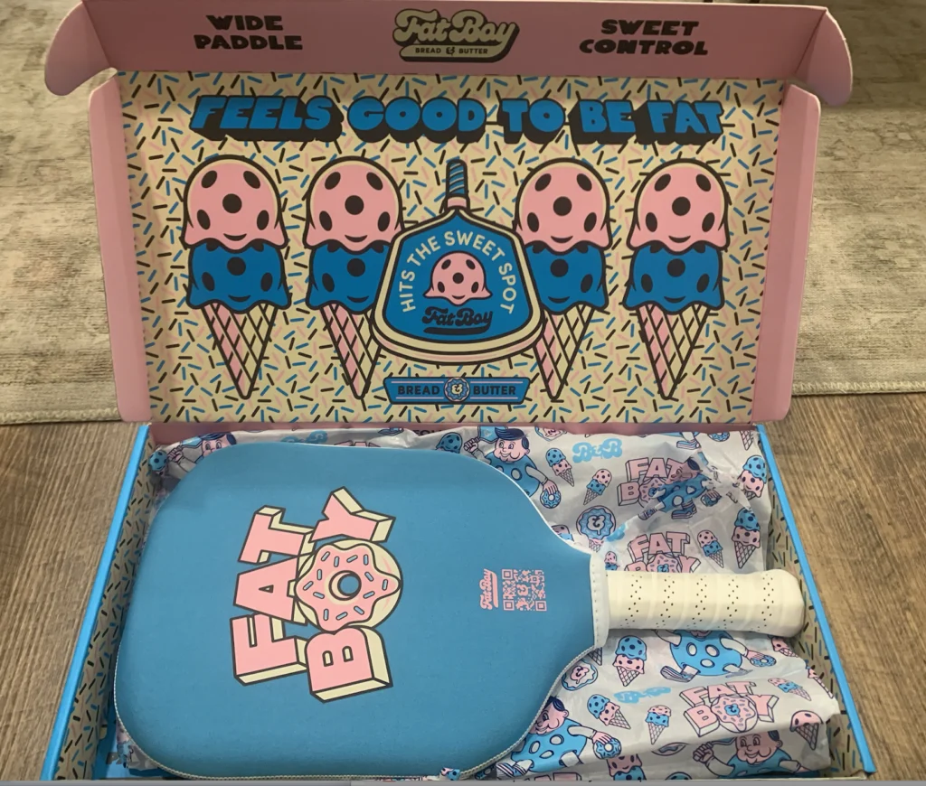 Picture of the open box of the Fat Boy pickleball paddle.