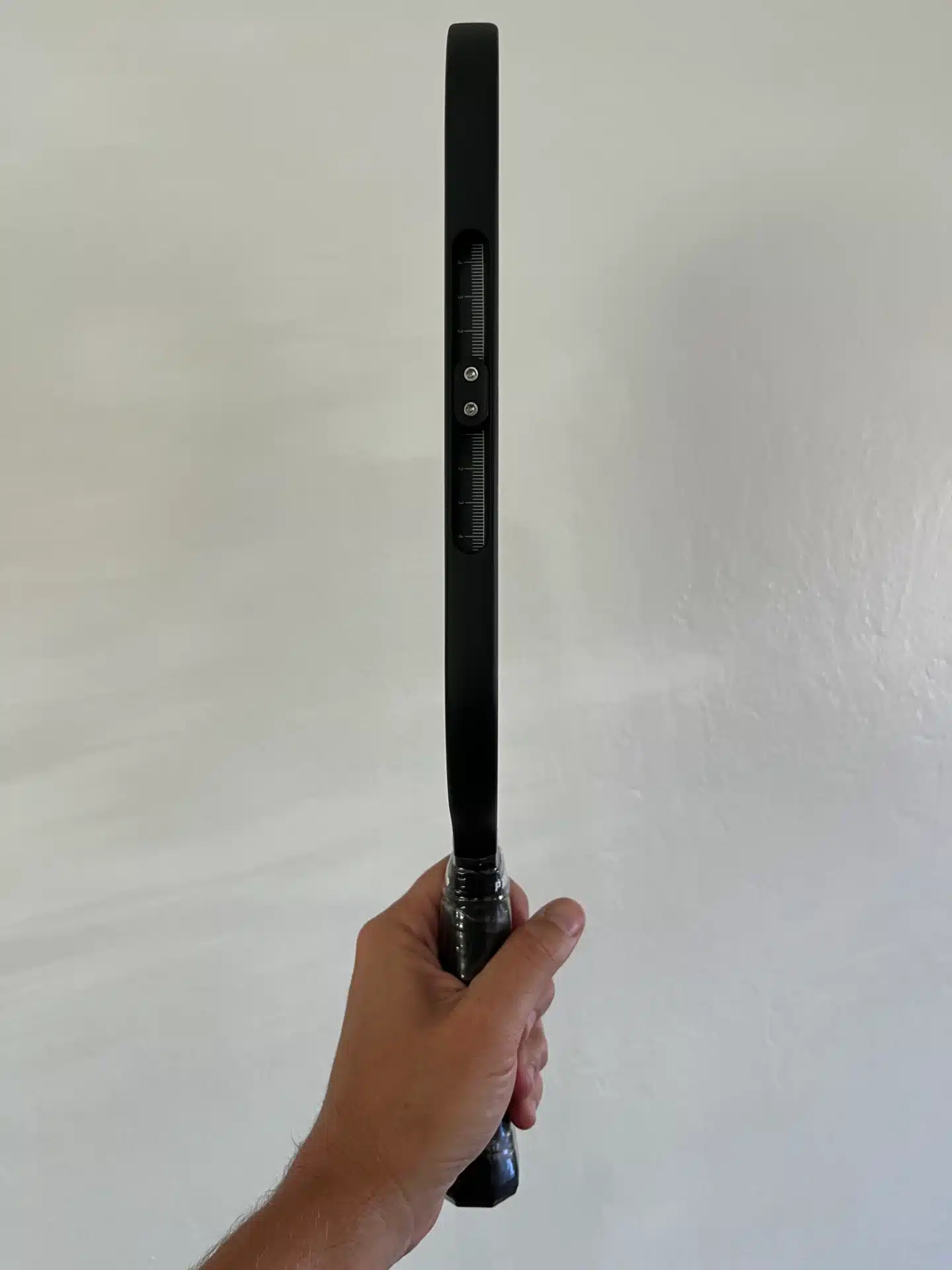 Side angle picture of the 
Paddlesshop Rhylion pickleball paddle.